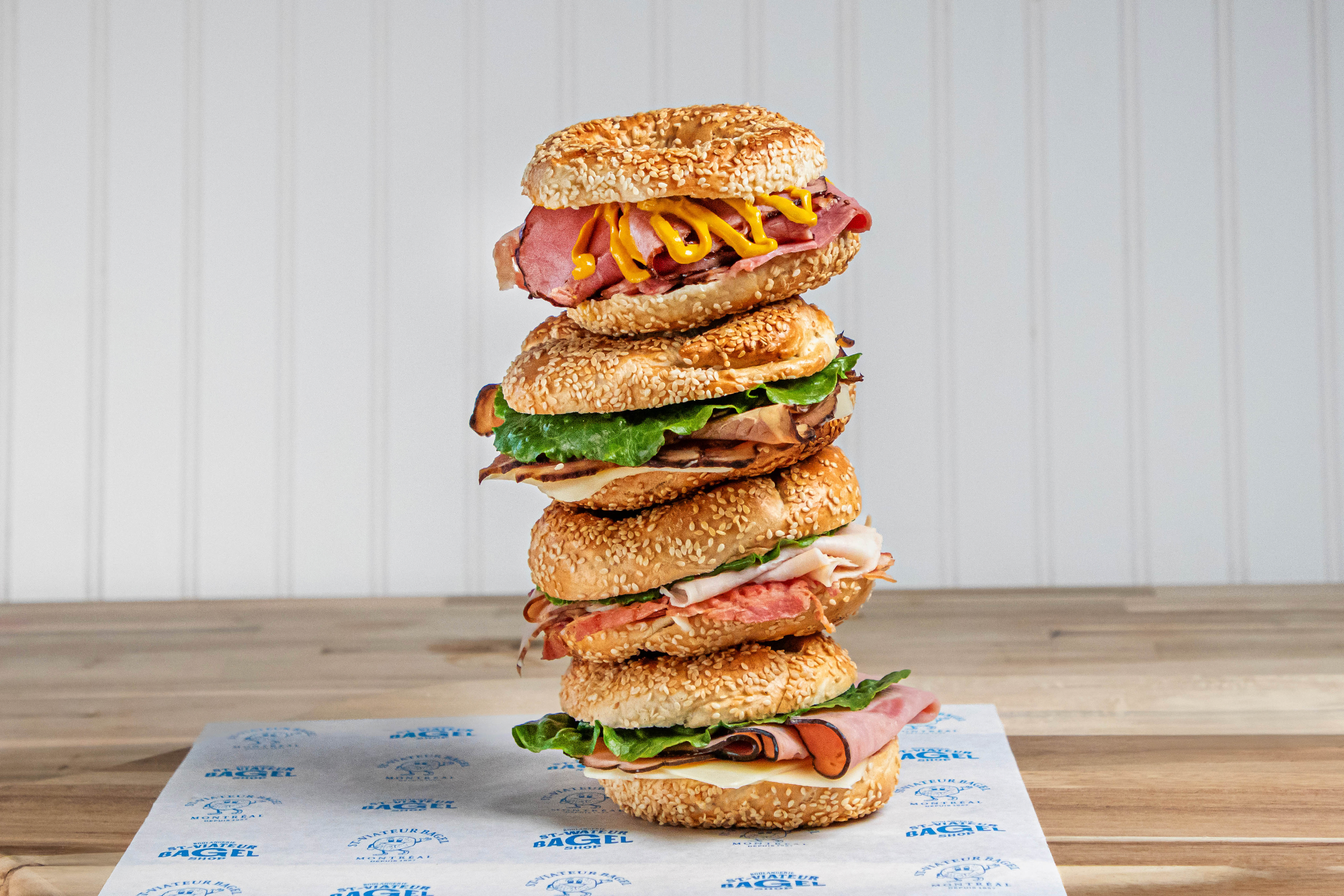 Stack of fresh St-Viateur Bagel sandwiches from the catering menu.