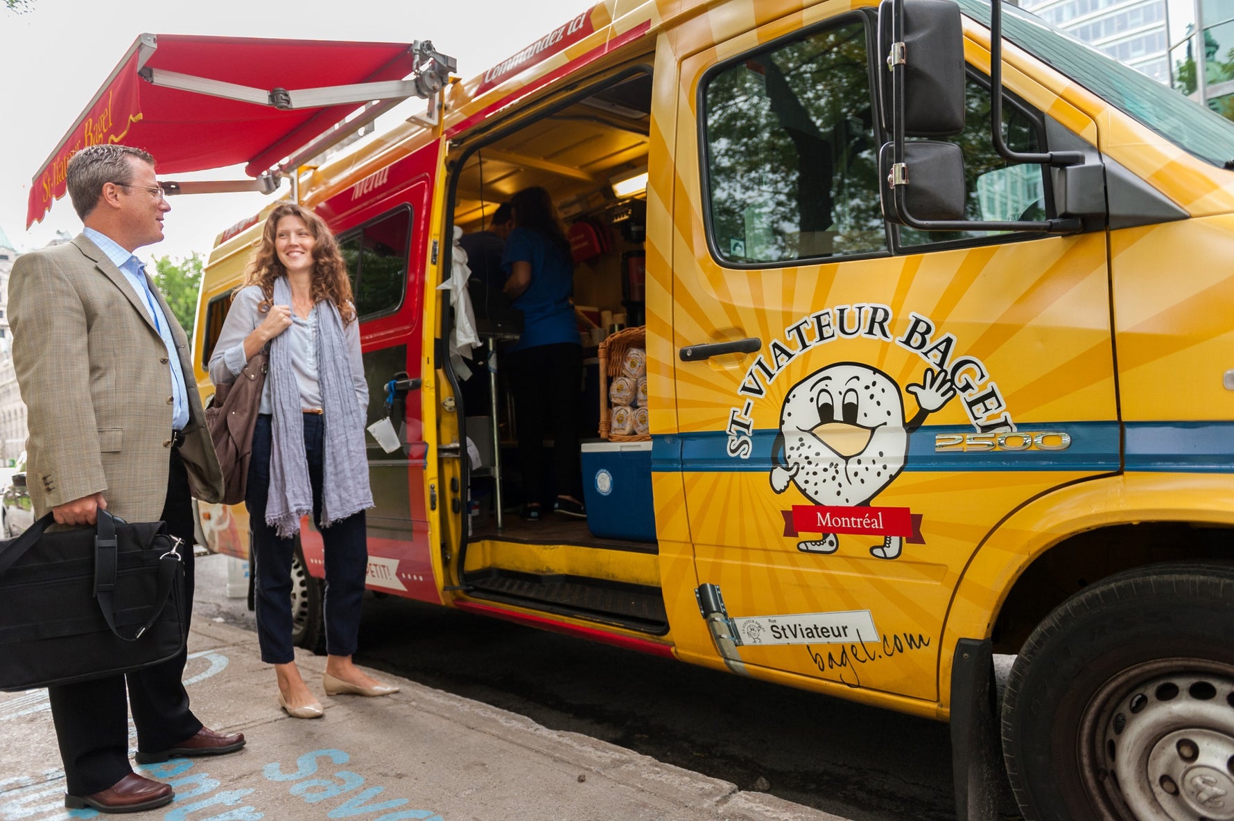 People waiting for bagels from the St-Viateur catering food truck in Montreal.